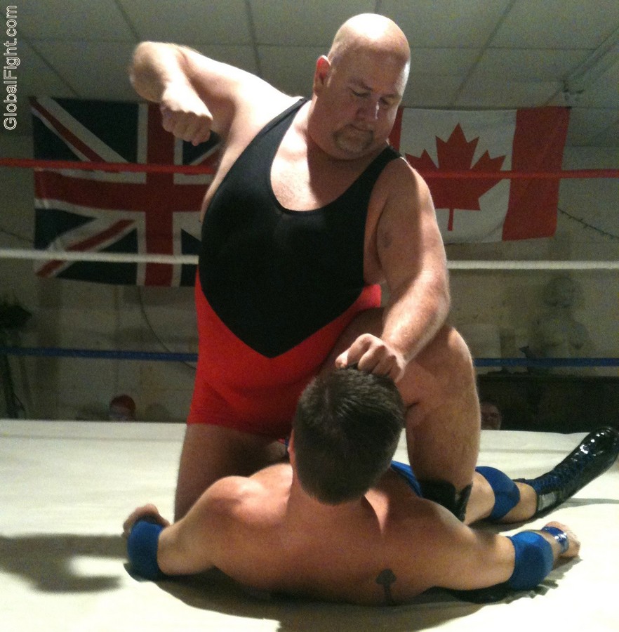 big guy beating up smaller man dude