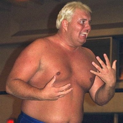 smooth blond bombshell large muscular arms in grappling indy event